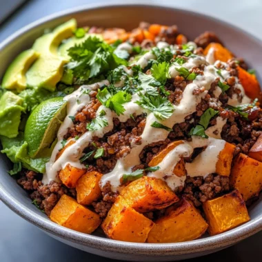 Delicious Ground Beef Sweet Potato Taco Bowl with Lime Crema